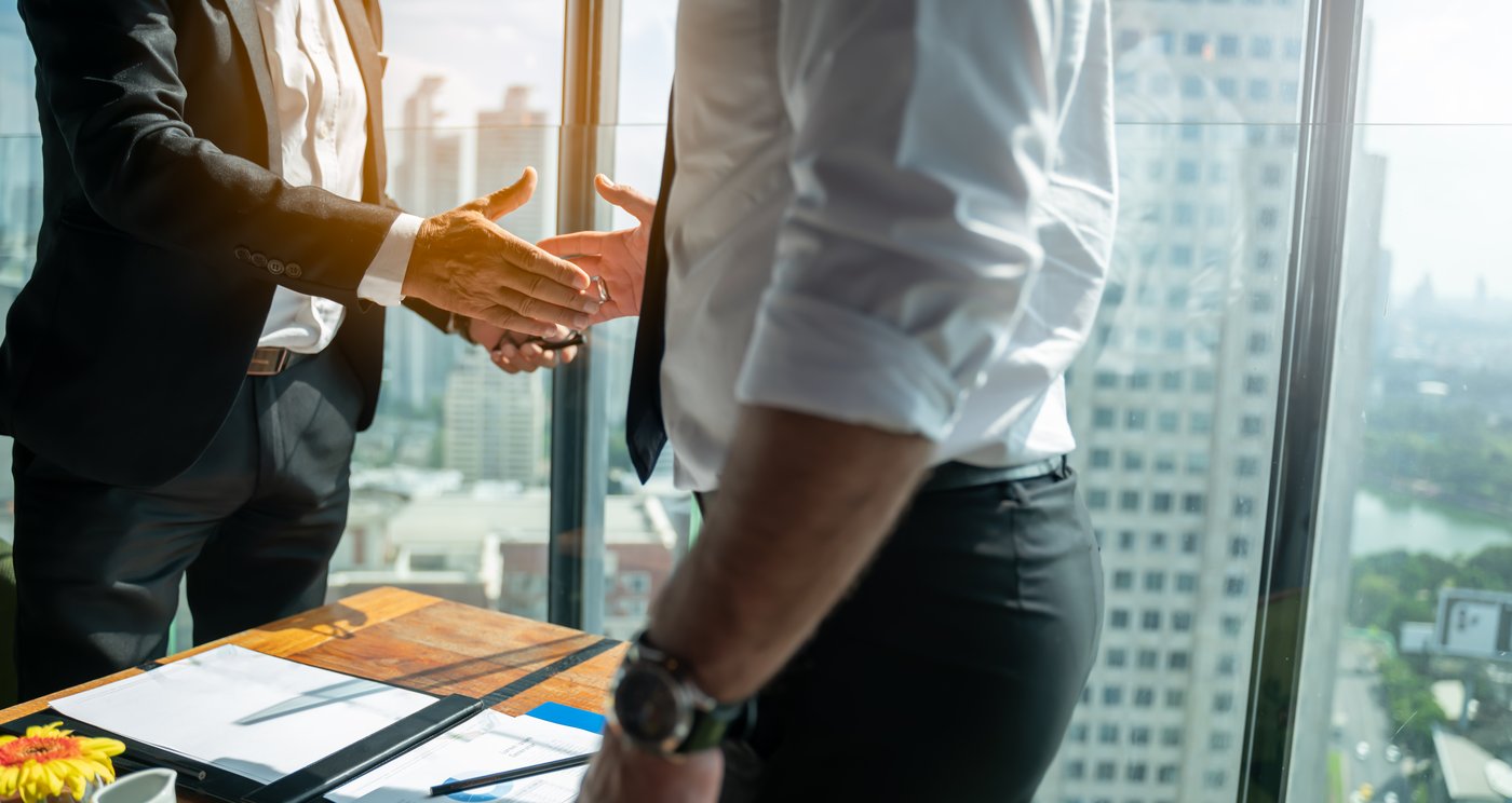 Business owners shaking hands on a deal