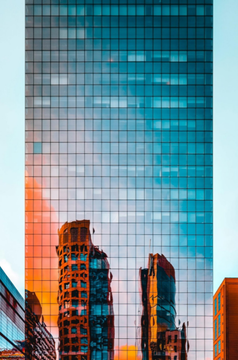 Downtown high-rise reflecting a sunset